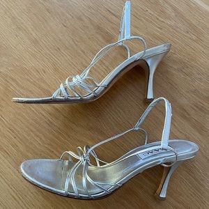 Strappy silver heels.